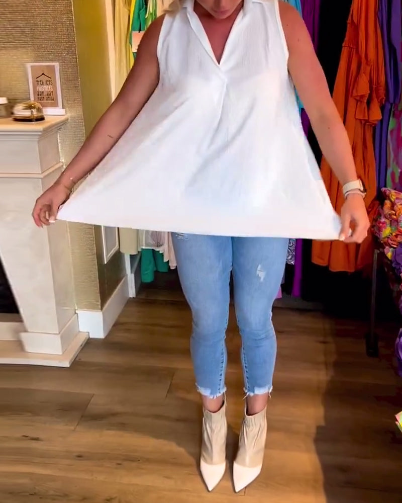 Mouwloze top met ruches en revers