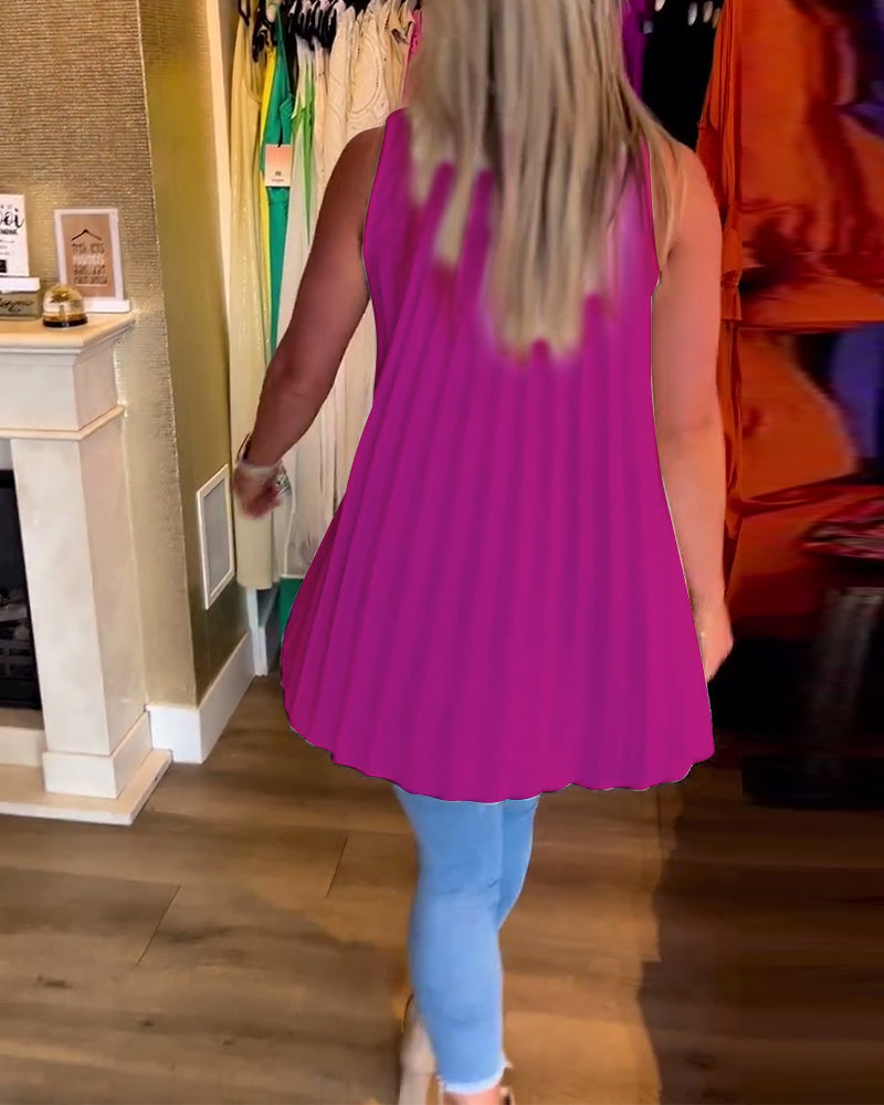 Mouwloze top met ruches en revers