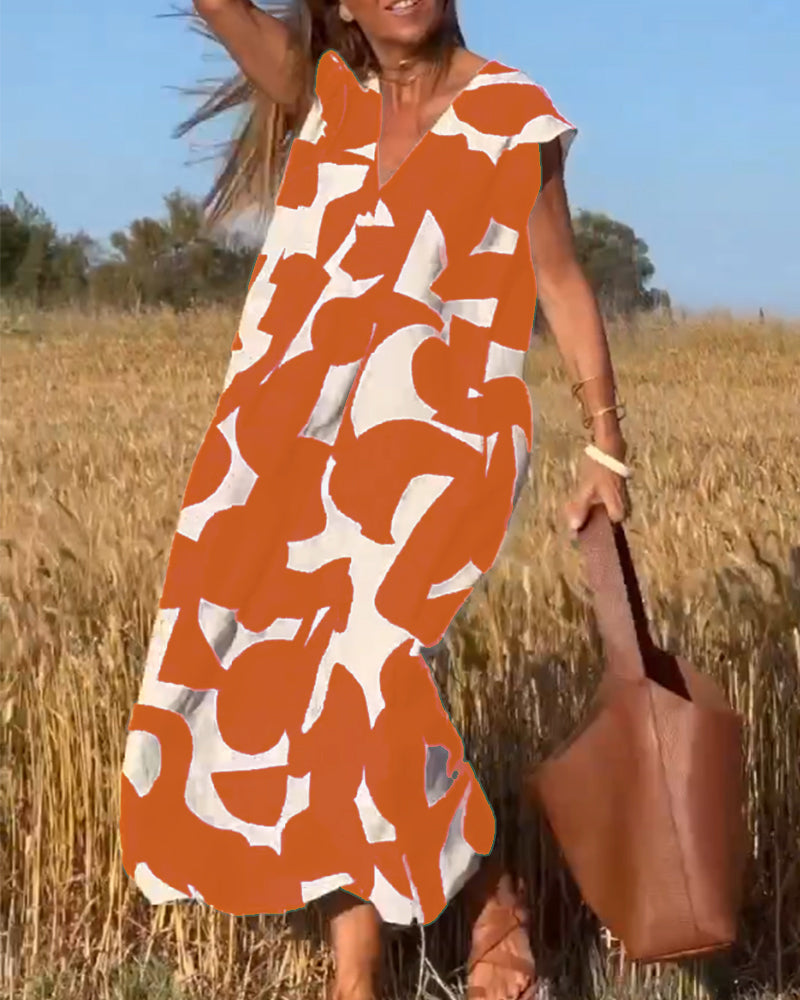 NAOMI | Lange Geprinte Jurk met V-hals en Uitlopende Pasvorm voor een Vakantielook