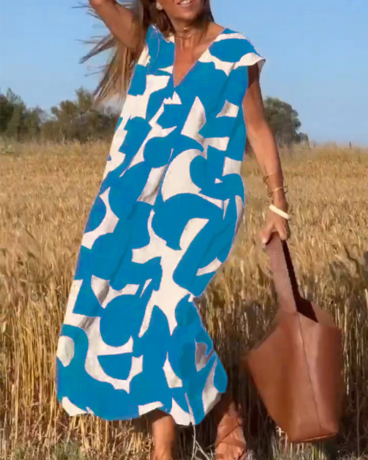 NAOMI | Lange Geprinte Jurk met V-hals en Uitlopende Pasvorm voor een Vakantielook